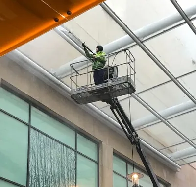 Image of commercial window cleaning with crane and MEPS